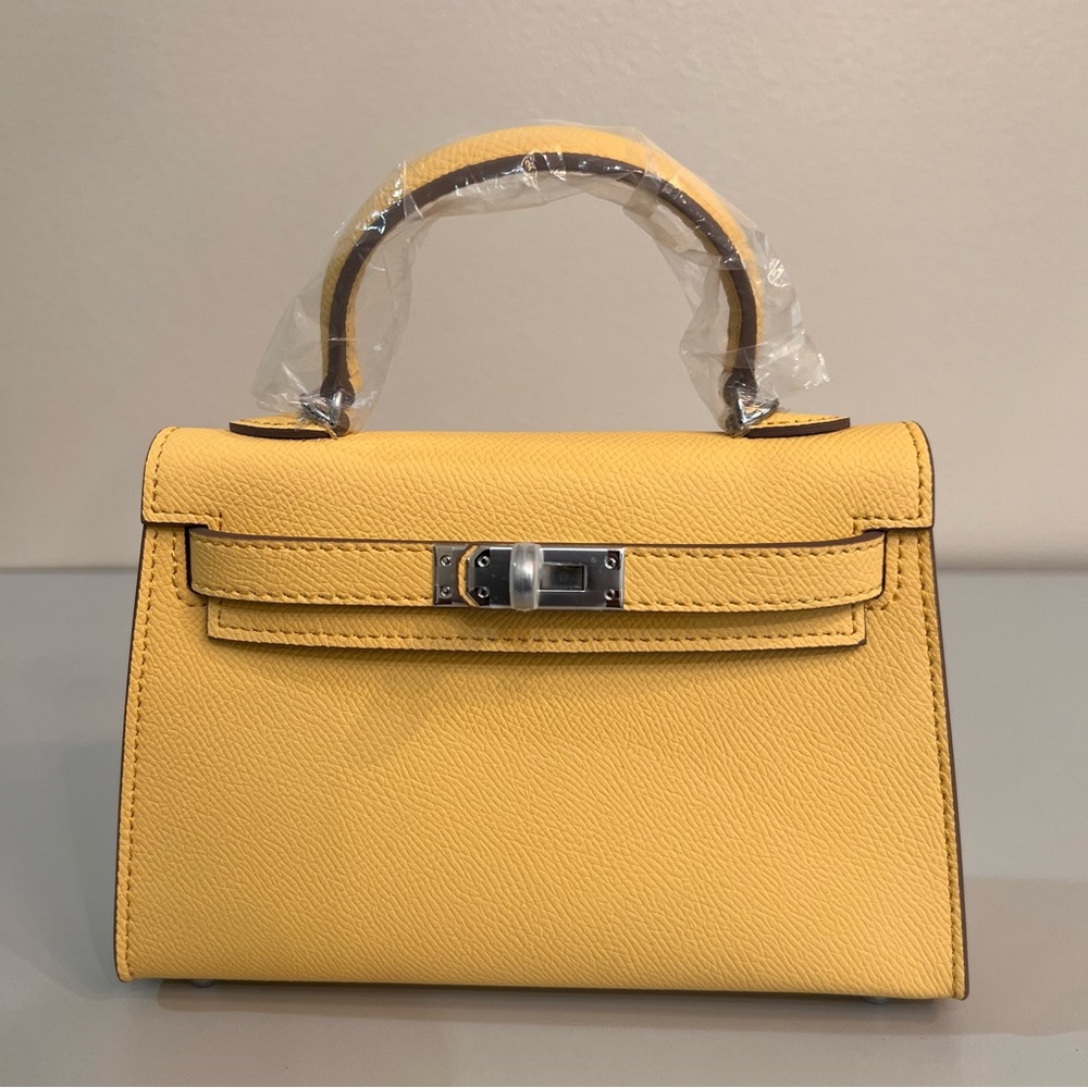 Genuine Epsom Leather mini handbag with shoulder strap featuring silver hardware